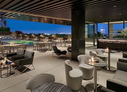 Outdoor a.lounge at WeHo at dusk with candles buning on tables