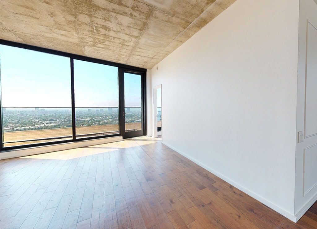 Unfurnished penthouse apartment with floor to ceiling windows