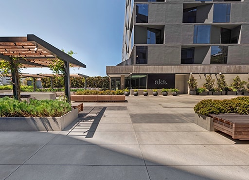Interior court plaza at West Hollywood apartments with pergolas and varios seating